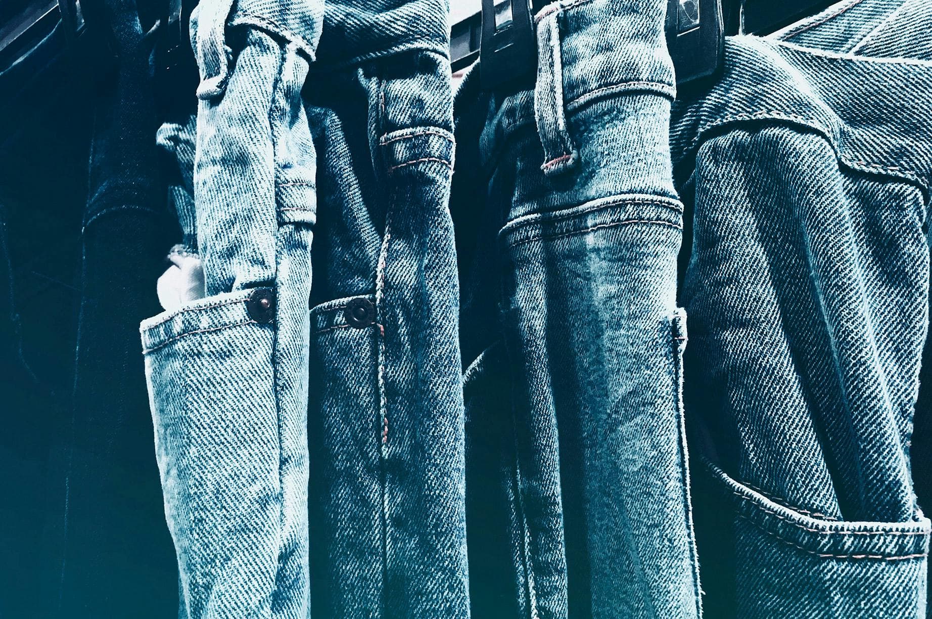 Rack of premium used denim jeans